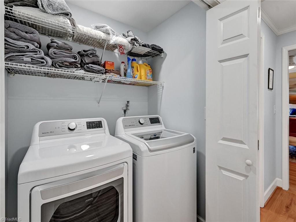 798 Hertford Road Winston-Salem, NC 27104 - Photo 19 of 36 The laundry was moved to the main level in the hall leading to the primary bedroom suite
