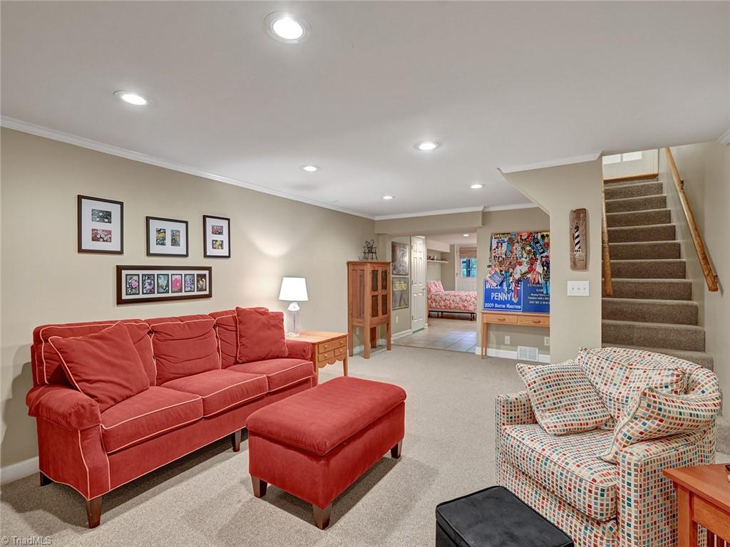 798 Hertford Road Winston-Salem, NC 27104 - Photo 28 of 36 The partially finished basement has a carpeted den