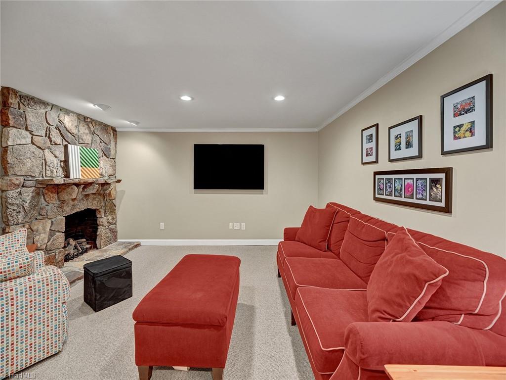 798 Hertford Road Winston-Salem, NC 27104 - Photo 29 of 36 The den also has a gas fireplace (TV does not convey but the bracket will remain).
