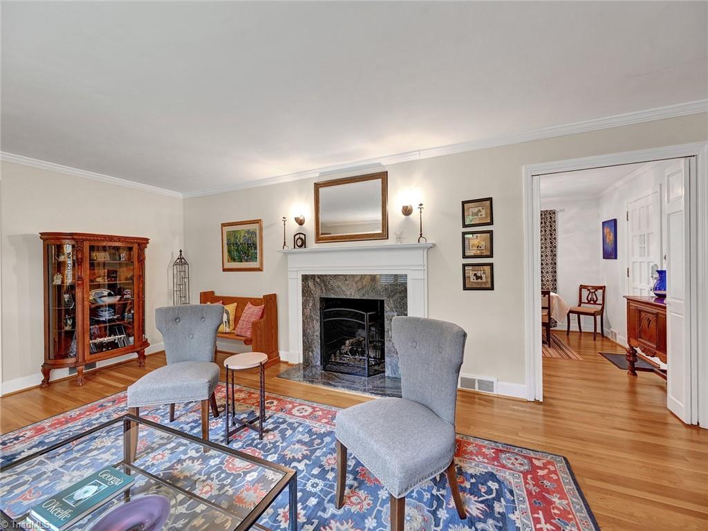 798 Hertford Road Winston-Salem, NC 27104 - Photo 8 of 36 The living room has a hardwood floors and a gas fireplace.