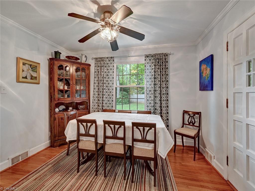 798 Hertford Road Winston-Salem, NC 27104 - Photo 10 of 36 The dining room also has hardwood floors. The door to the left leads to the garage, to the left is the kitchen