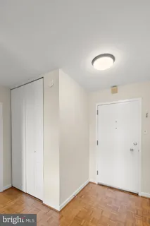 a kitchen with stainless steel appliances a refrigerator a sink a stove and cabinets