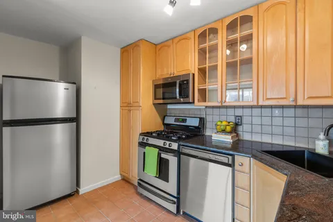 a bathroom with a toilet sink and shower