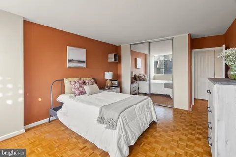 a view of a room with wooden floor