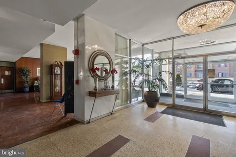 a view of a tall building next to a road