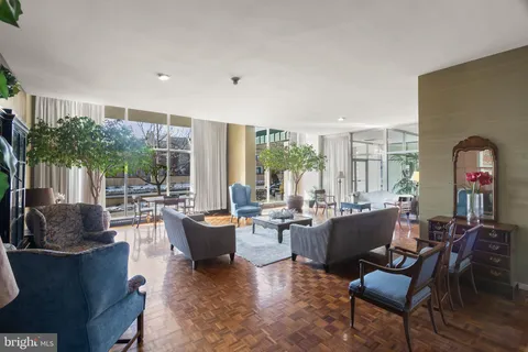 a view of a tall building next to a road