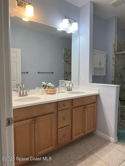 3111 Le Conte Street Melbourne, FL 32940 - Photo 17 of 33 a bathroom with a double vanity sink and a mirror
