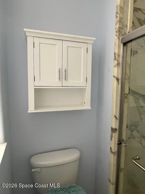3111 Le Conte Street Melbourne, FL 32940 - Photo 18 of 33 a white toilet sitting next to a bathroom sink
