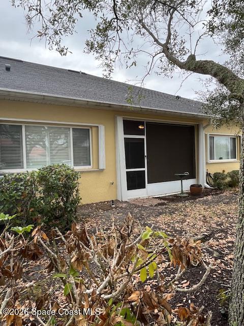 3111 Le Conte Street Melbourne, FL 32940 - Photo 24 of 33 a view of a house with a patio and a yard