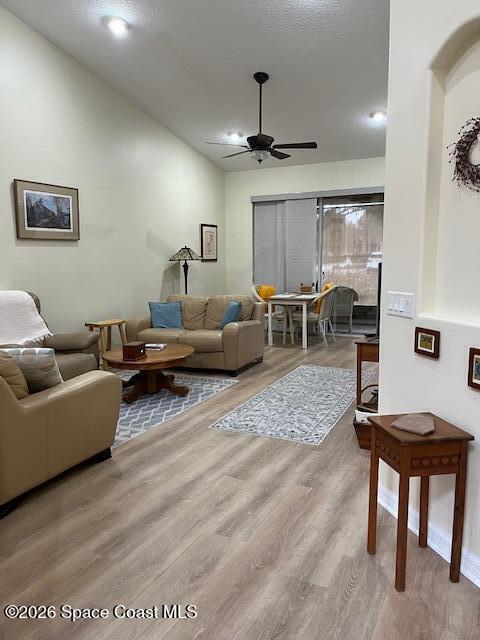 3111 Le Conte Street Melbourne, FL 32940 - Photo 3 of 33 a living room with furniture a ceiling fan and a rug
