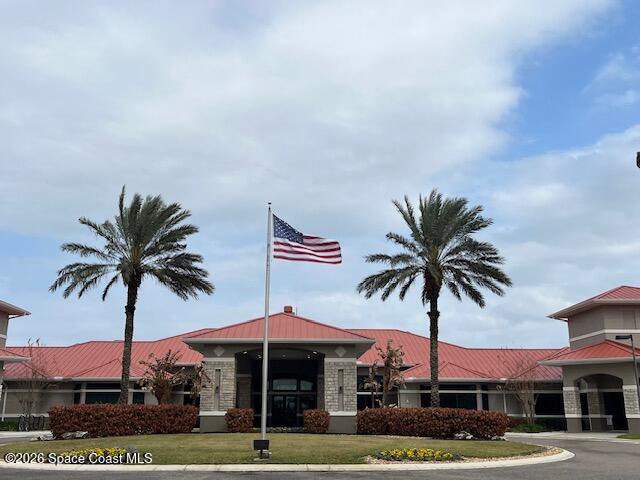 3111 Le Conte Street Melbourne, FL 32940 - Photo 33 of 33 a front view of a building with garage and palm trees
