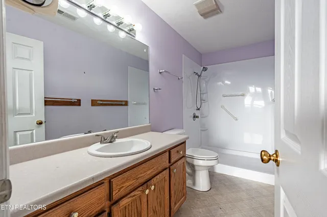 a view of a hallway with wooden door