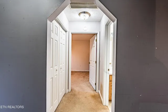 a bathroom with a granite countertop sink toilet a mirror a shower and a tub