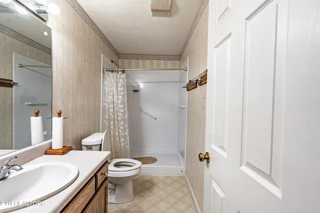 a bathroom with a sink vanity and a mirror