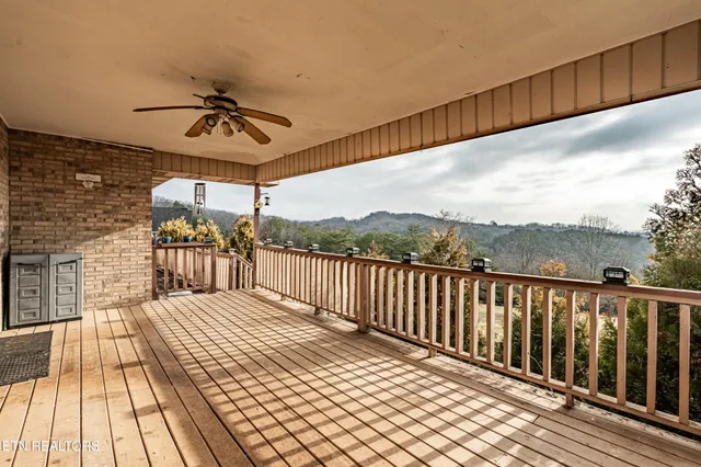 a view of a balcony with a glass door