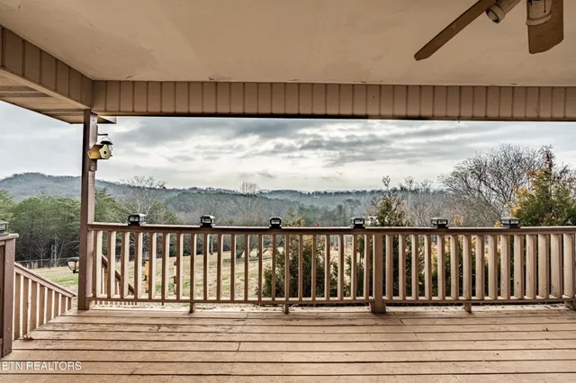 a view of a balcony with wooden fence