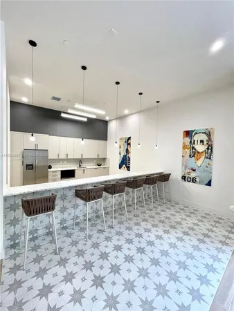 a room with pool table and window