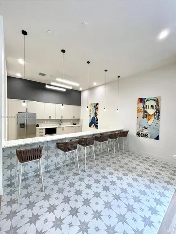 a room with pool table and window