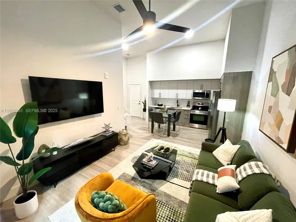 a living room with furniture and a flat screen tv