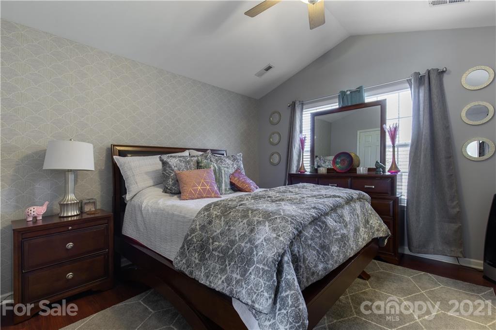 501 Poseidon Way Fort Mill, SC 29708 - Photo 13 of 19 a bed room with a bed and a dresser