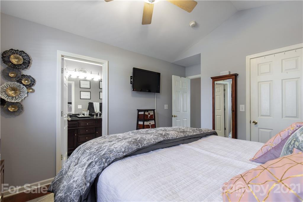 501 Poseidon Way Fort Mill, SC 29708 - Photo 14 of 19 a bedroom with a bed and a flat screen tv