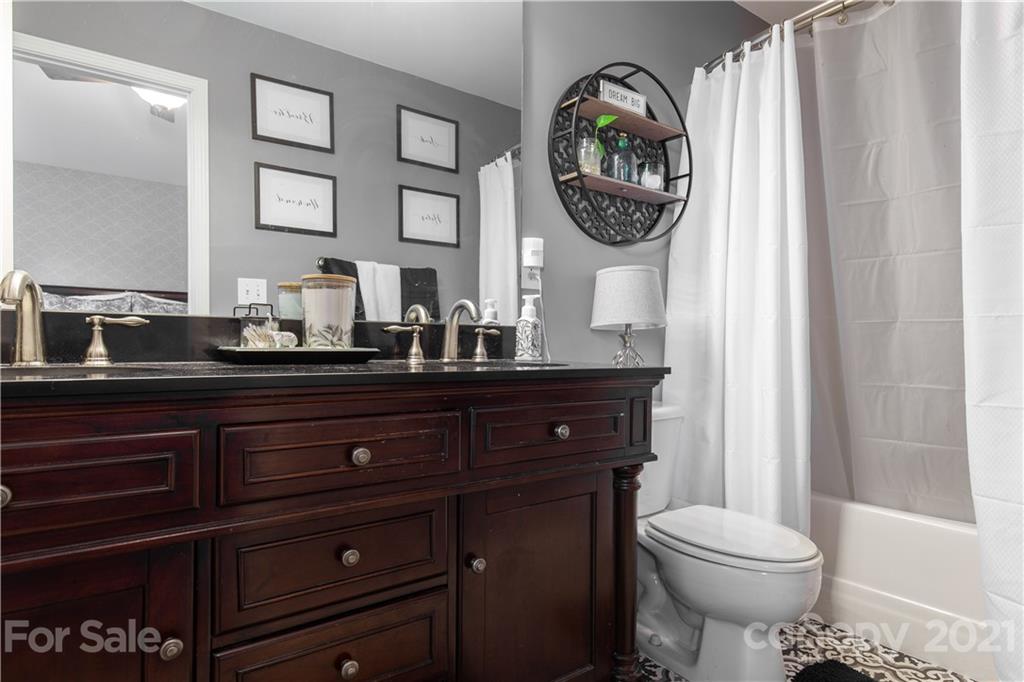 501 Poseidon Way Fort Mill, SC 29708 - Photo 15 of 19 a bathroom with a toilet a sink and a mirror