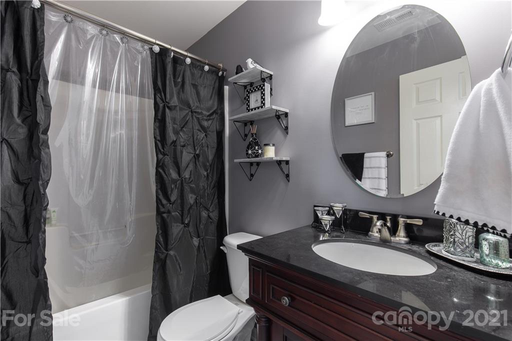 501 Poseidon Way Fort Mill, SC 29708 - Photo 16 of 19 a bathroom with a granite countertop sink toilet and shower