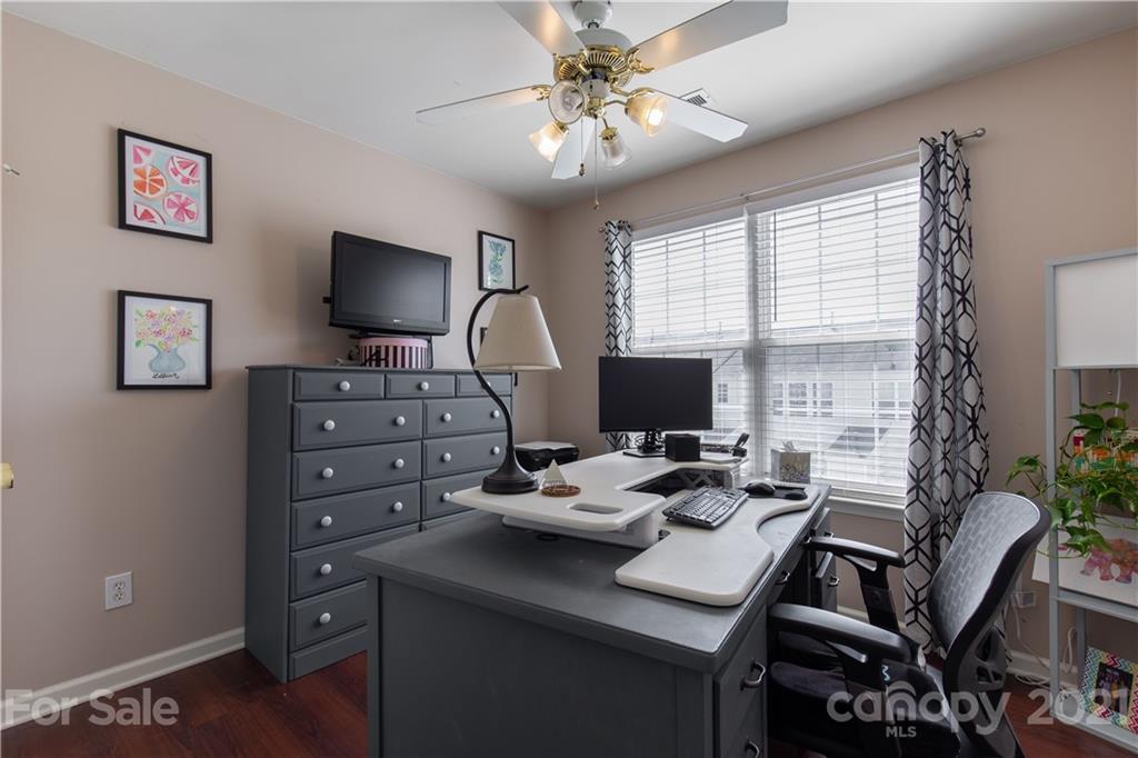 501 Poseidon Way Fort Mill, SC 29708 - Photo 17 of 19 a view of a workspace with furniture and a flat screen tv