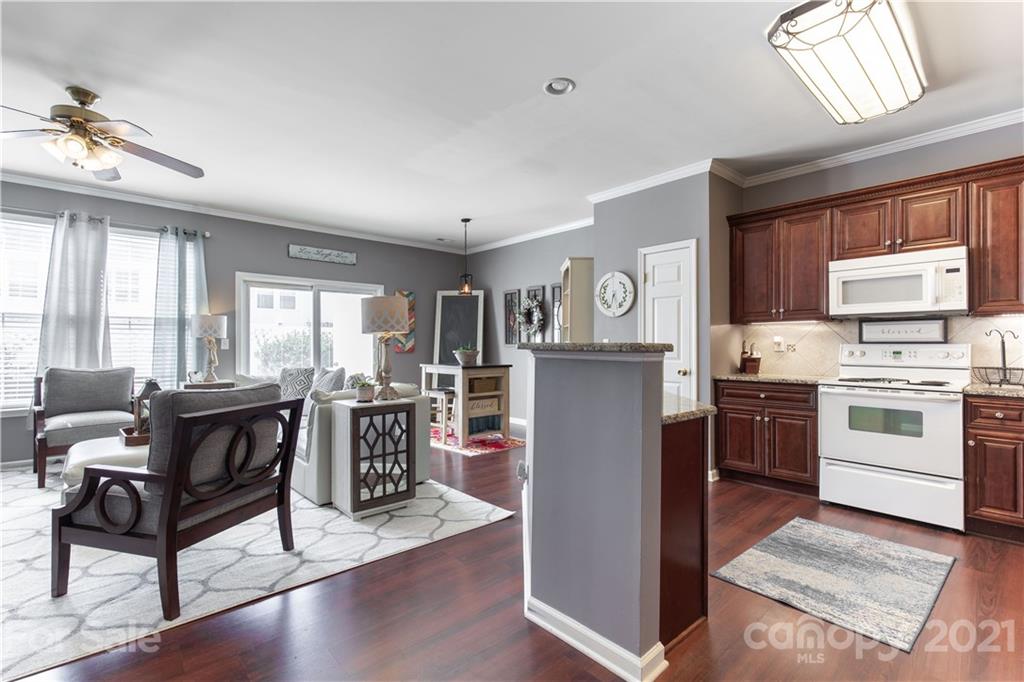 501 Poseidon Way Fort Mill, SC 29708 - Photo 7 of 19 a kitchen with a refrigerator and a stove top oven