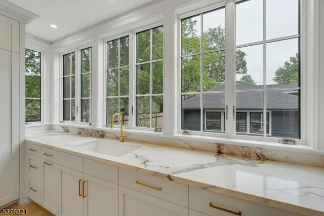 a bathroom with a sink and mirror