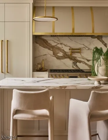 a kitchen with a table chairs stove and refrigerator