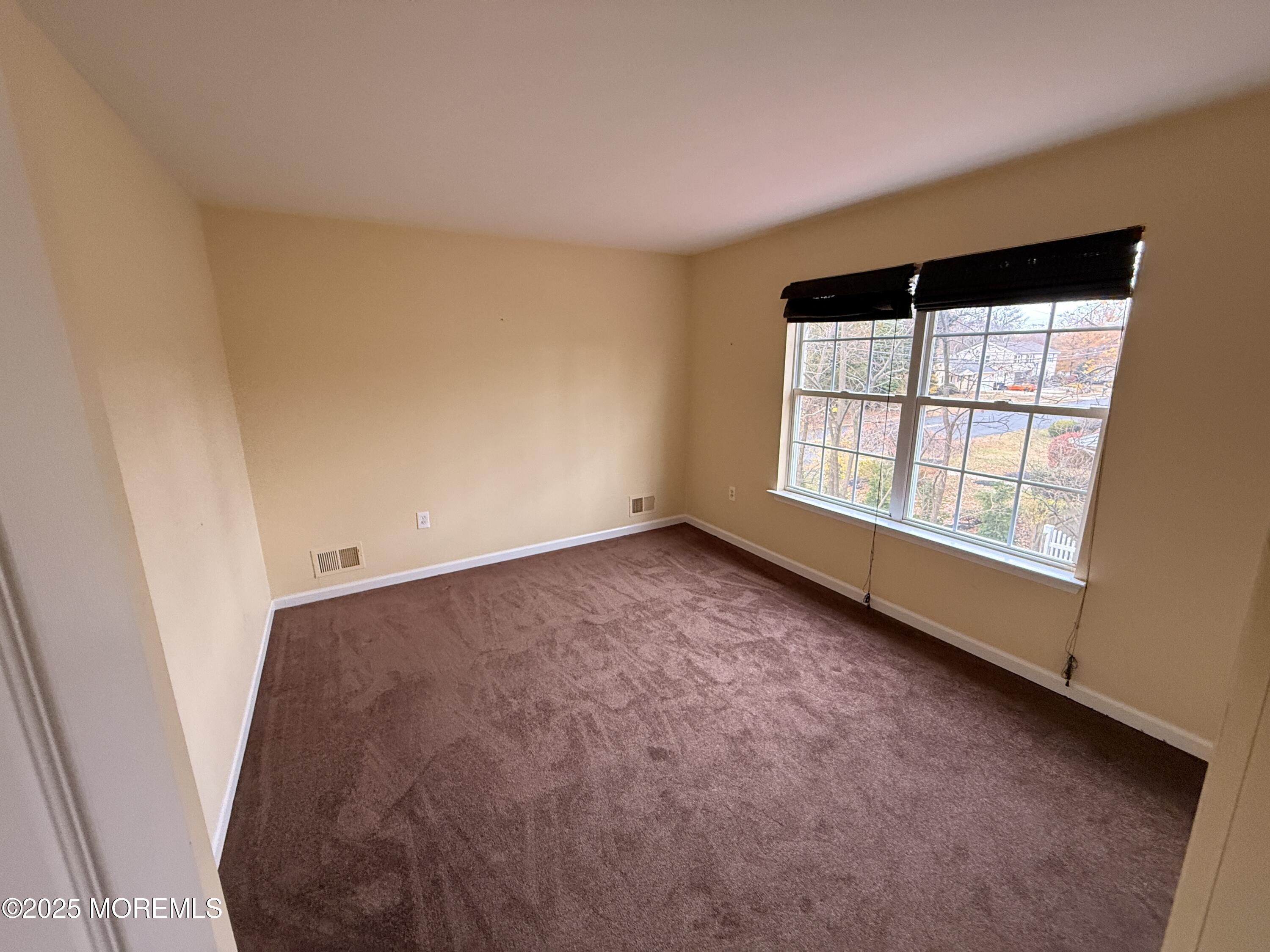 1811 Bellmore Street Oakhurst, NJ 07755 - Photo 15 of 49 an empty room with windows
