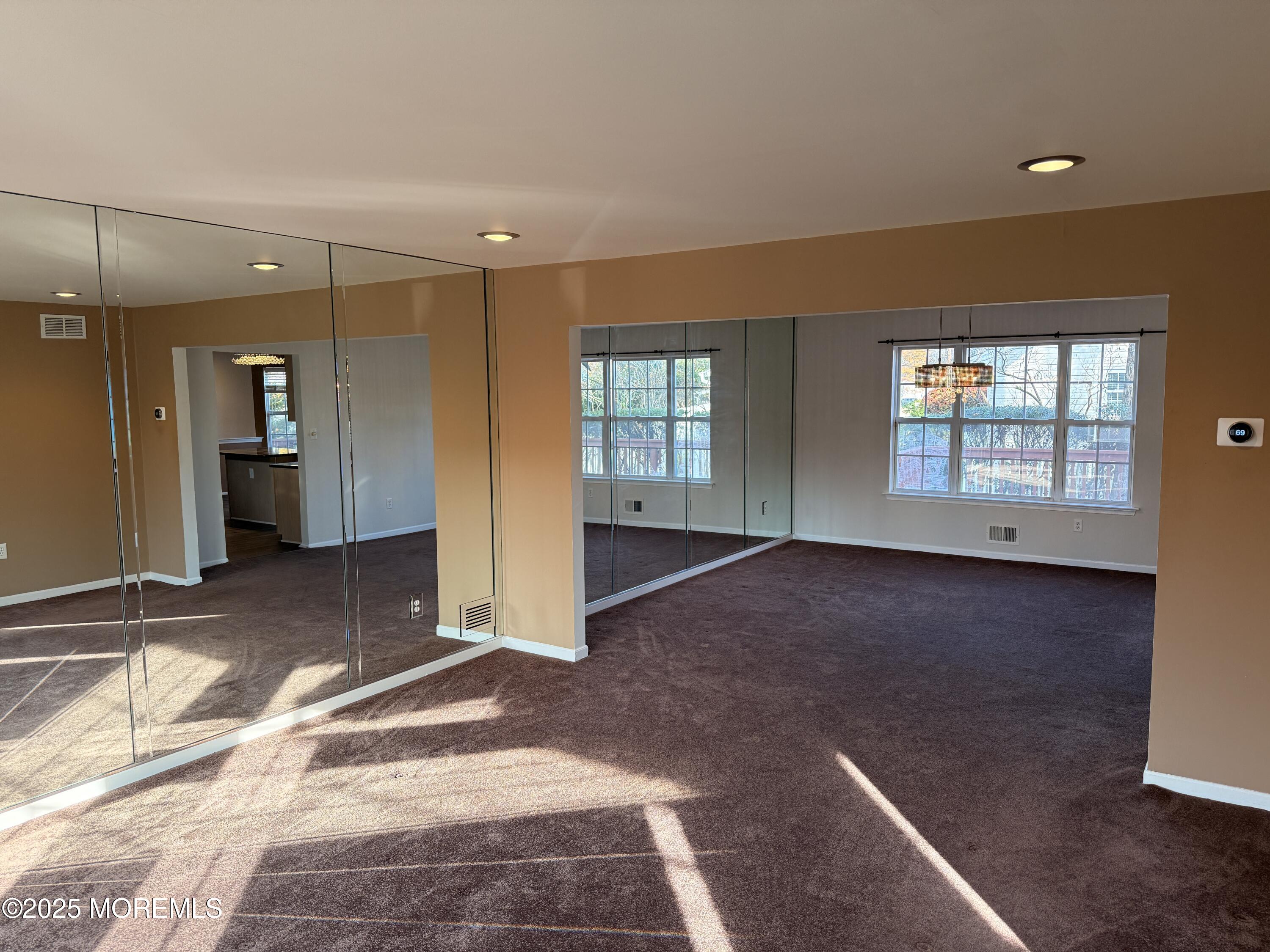 1811 Bellmore Street Oakhurst, NJ 07755 - Photo 2 of 49 an empty room with windows and entrance