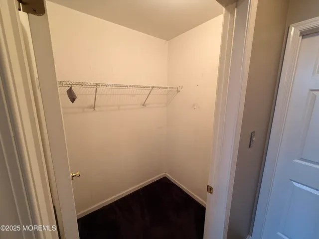 a bathroom with a sink double vanity granite and a mirror