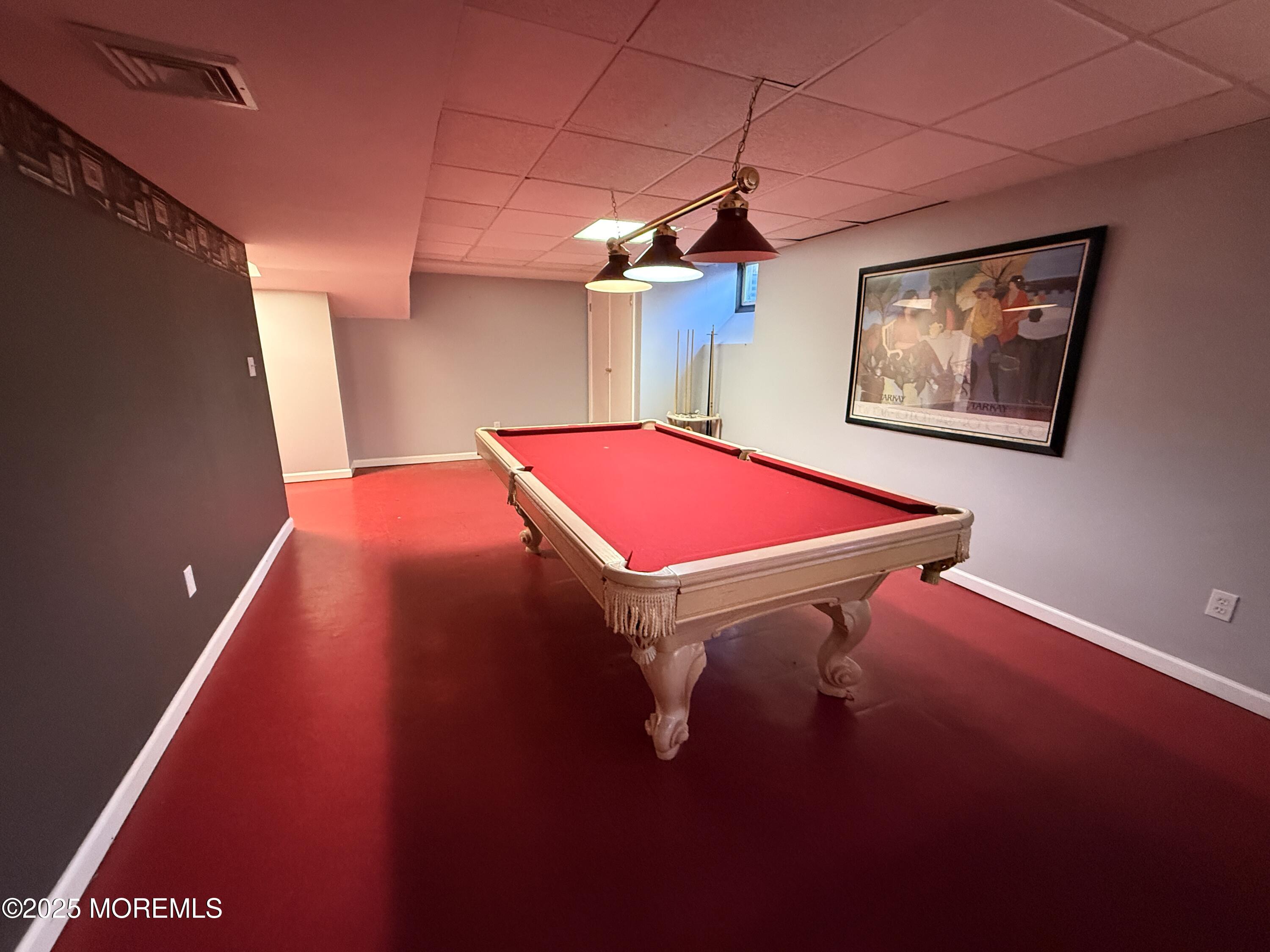 1811 Bellmore Street Oakhurst, NJ 07755 - Photo 24 of 49 a room with pool table and a chandelier