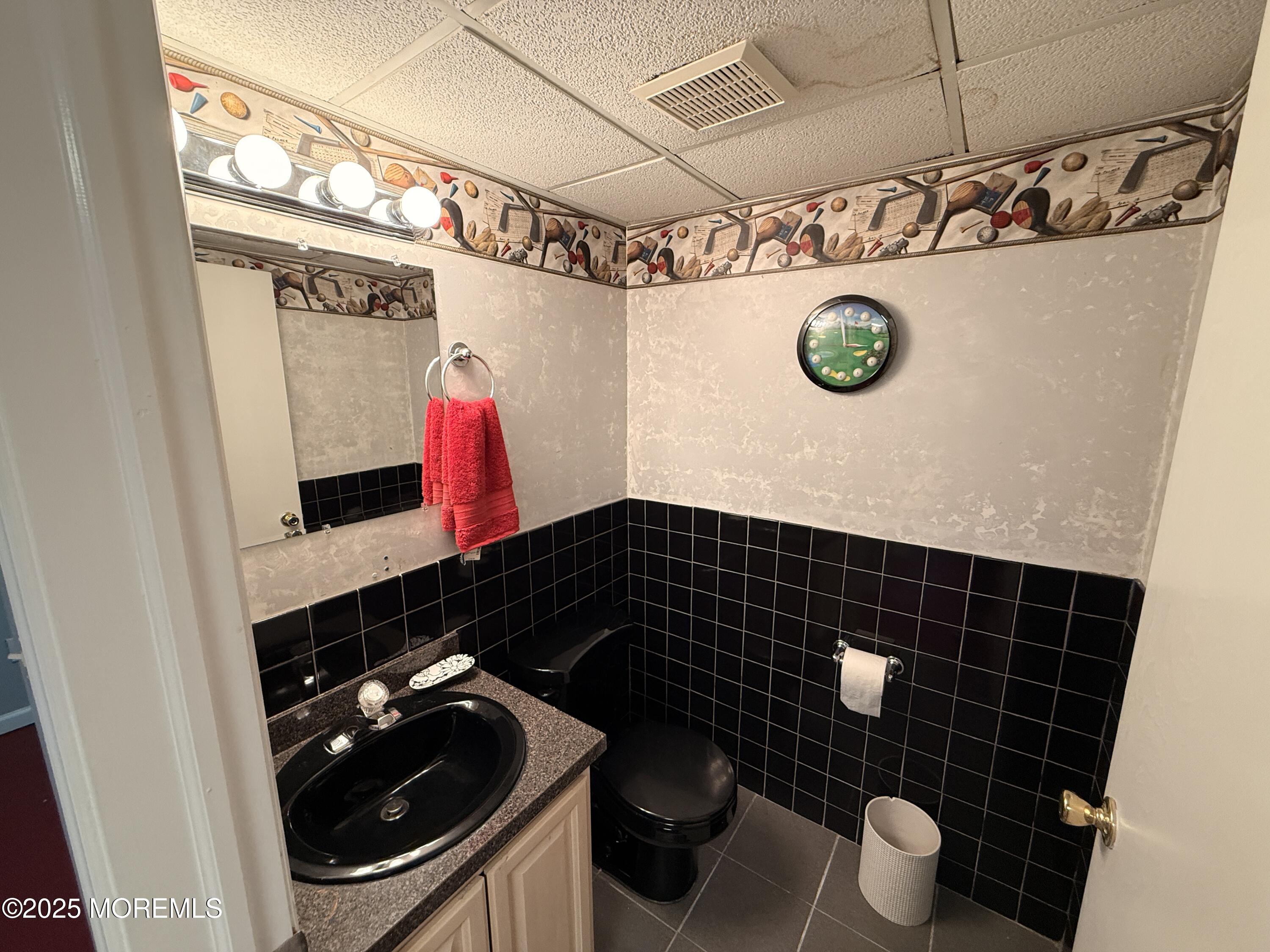 1811 Bellmore Street Oakhurst, NJ 07755 - Photo 30 of 49 a bathroom with a sink a toilet and a shower