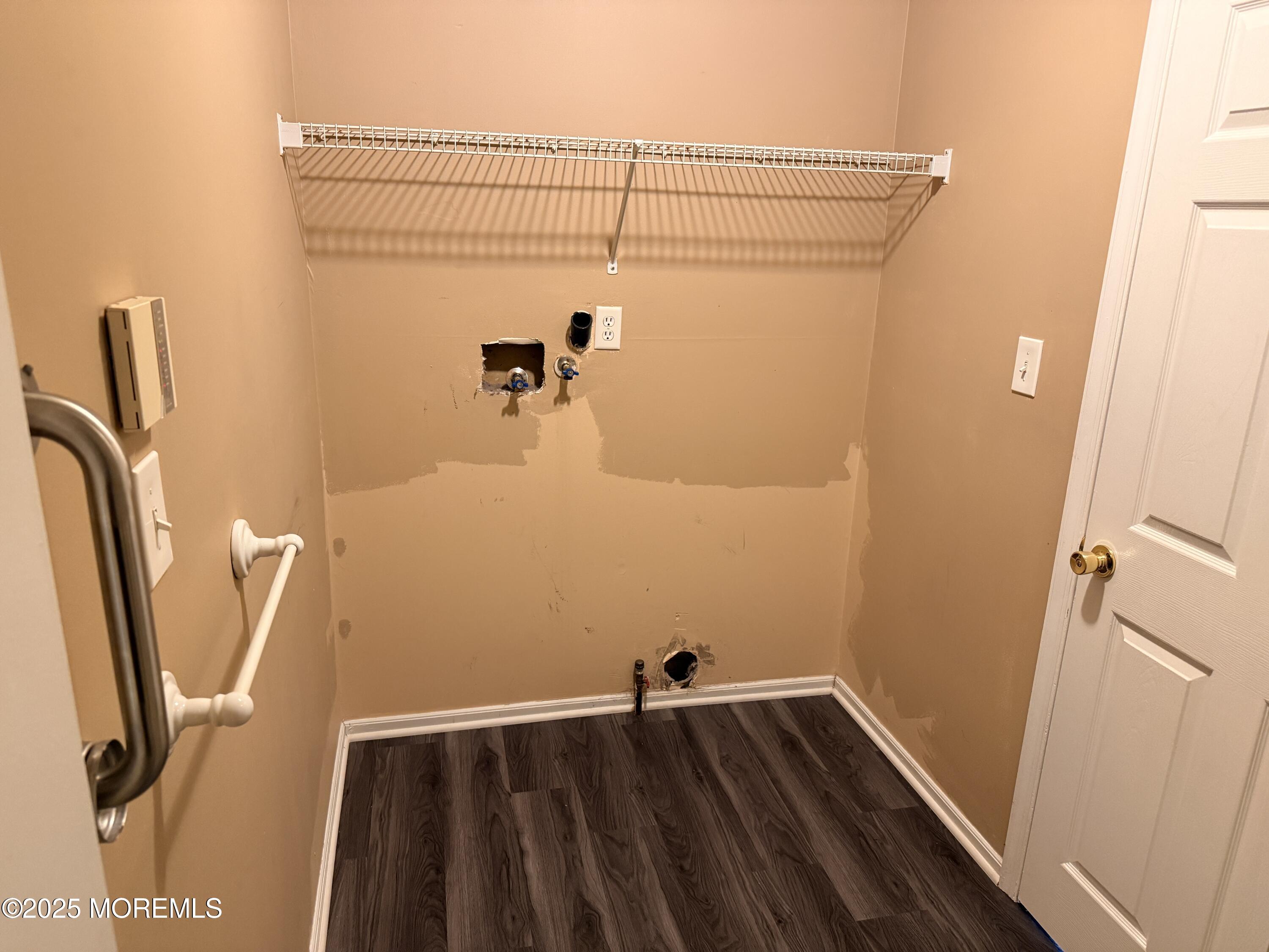 1811 Bellmore Street Oakhurst, NJ 07755 - Photo 35 of 49 a view of a room with rack on the wall