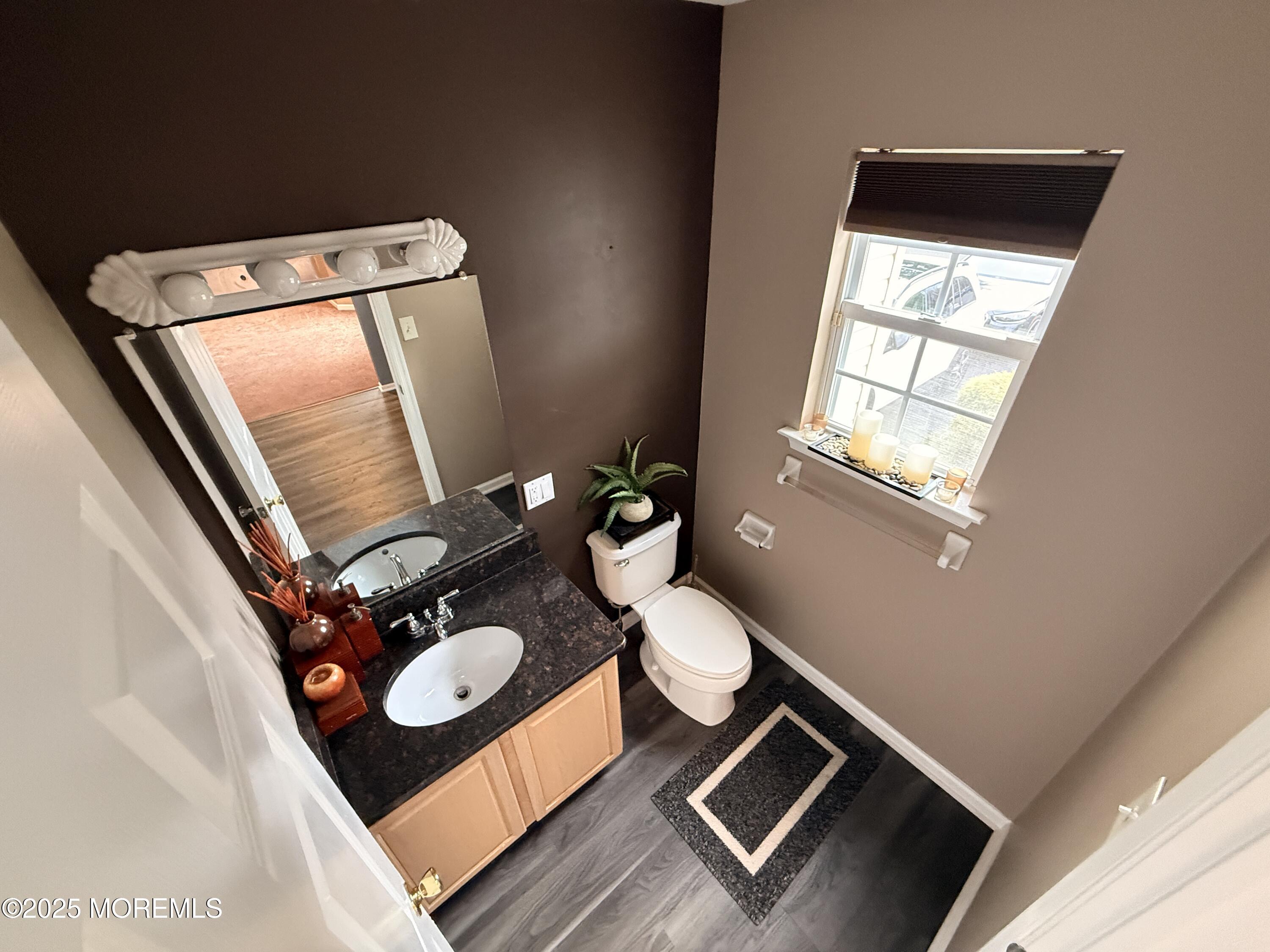 1811 Bellmore Street Oakhurst, NJ 07755 - Photo 4 of 49 a bathroom with a toilet mirror and a sink