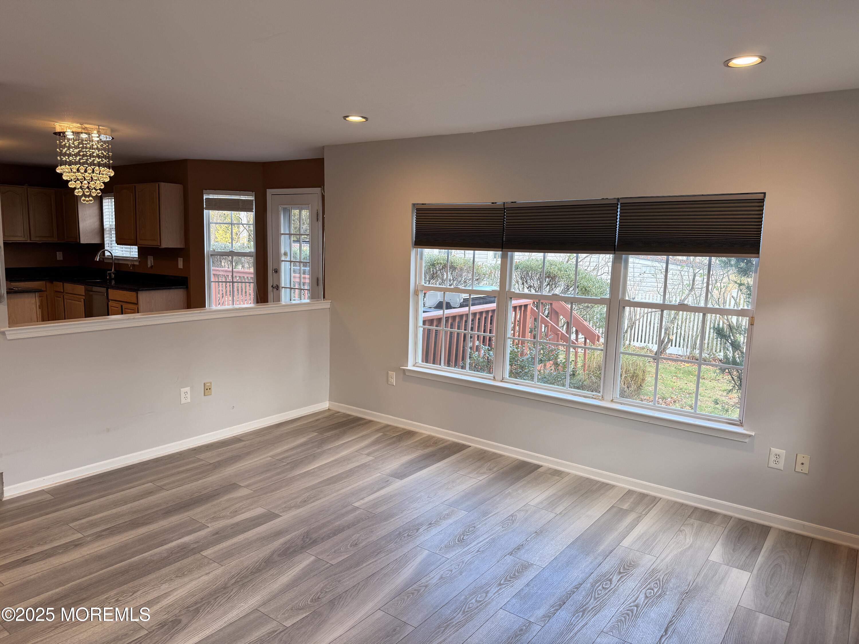 1811 Bellmore Street Oakhurst, NJ 07755 - Photo 41 of 49 an empty room with wooden floor and windows