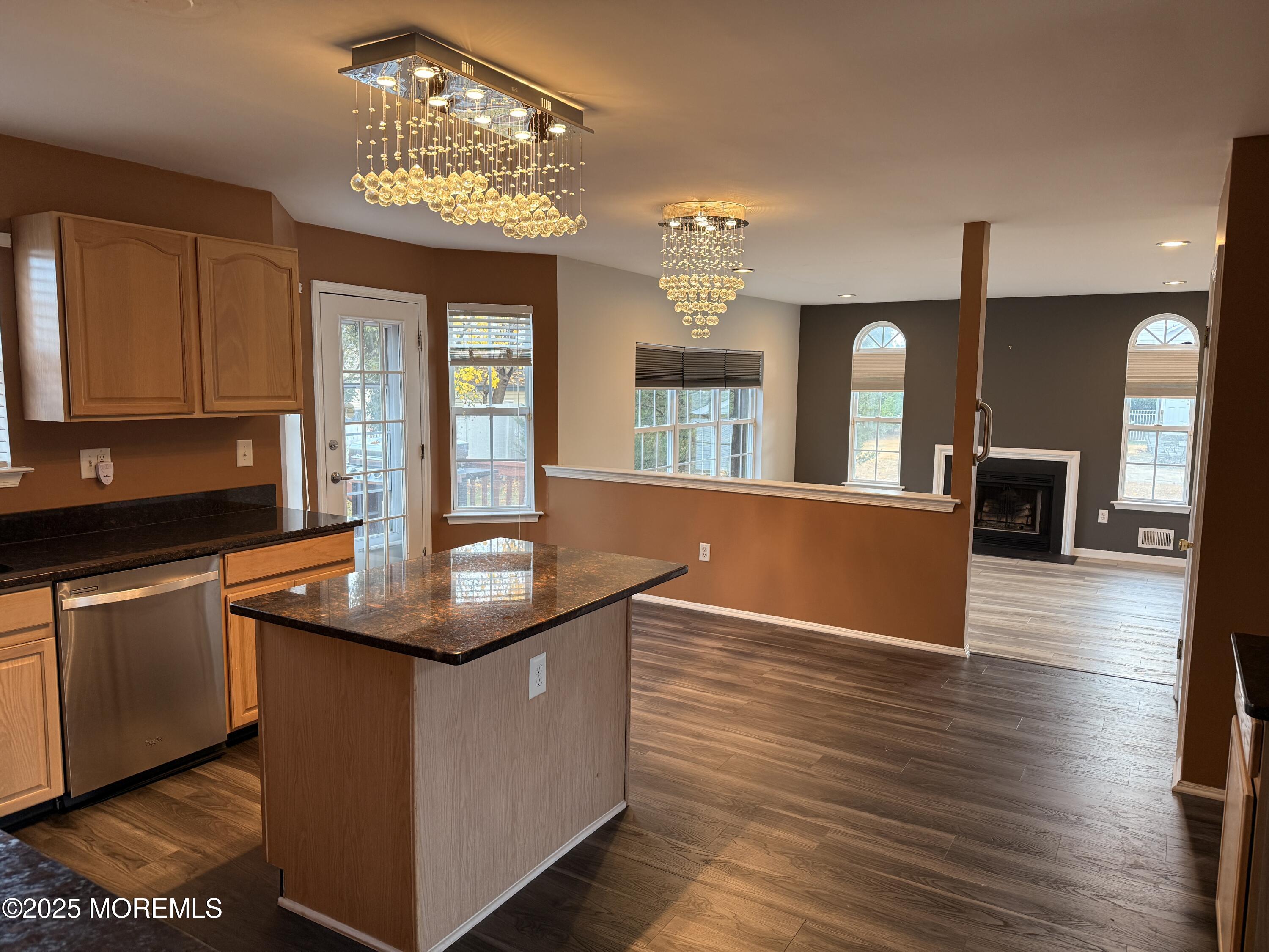 1811 Bellmore Street Oakhurst, NJ 07755 - Photo 45 of 49 a kitchen with stainless steel appliances granite countertop a sink a stove and wooden floor