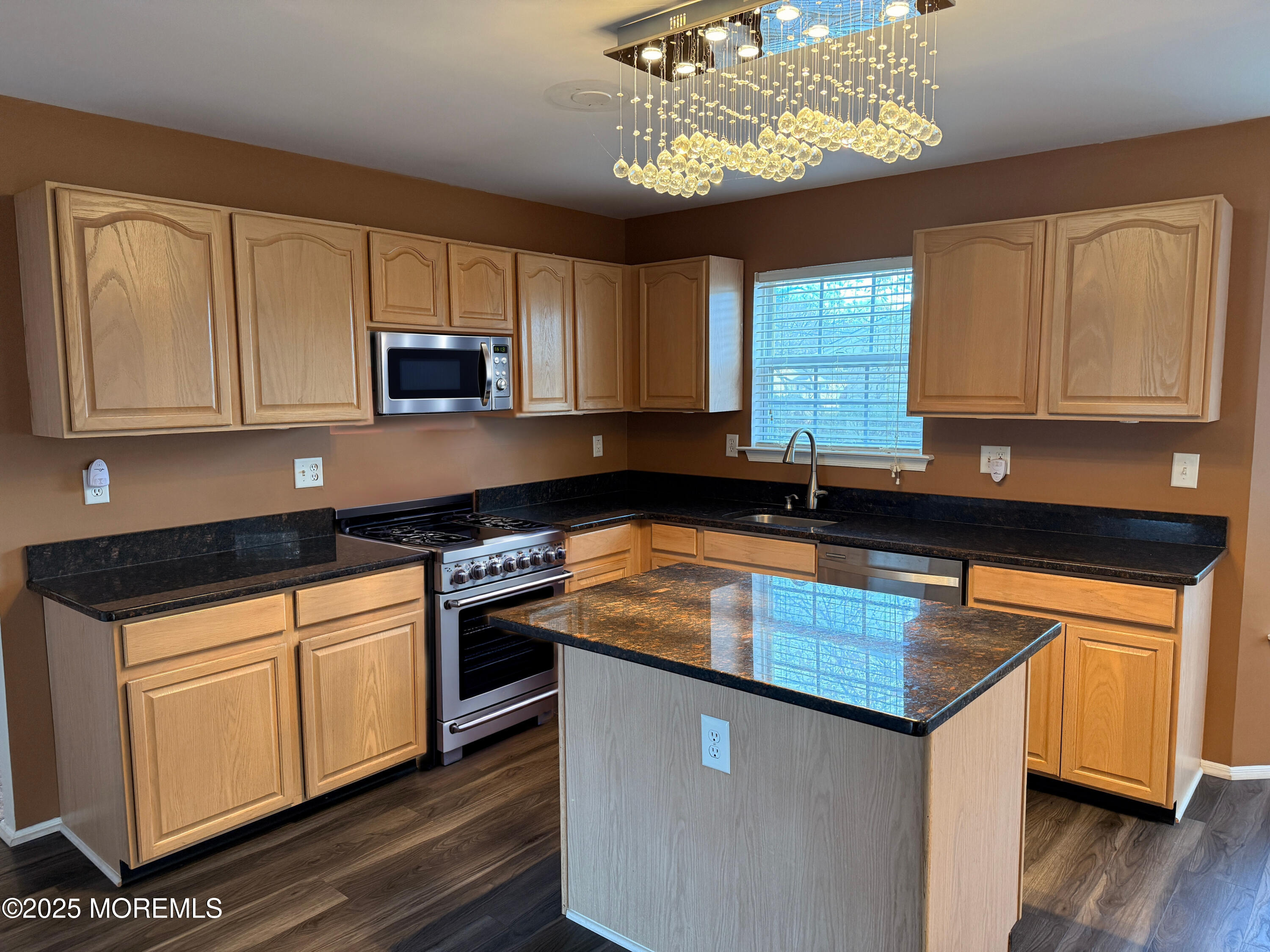 1811 Bellmore Street Oakhurst, NJ 07755 - Photo 47 of 49 a kitchen with stainless steel appliances granite countertop a sink stove and microwave