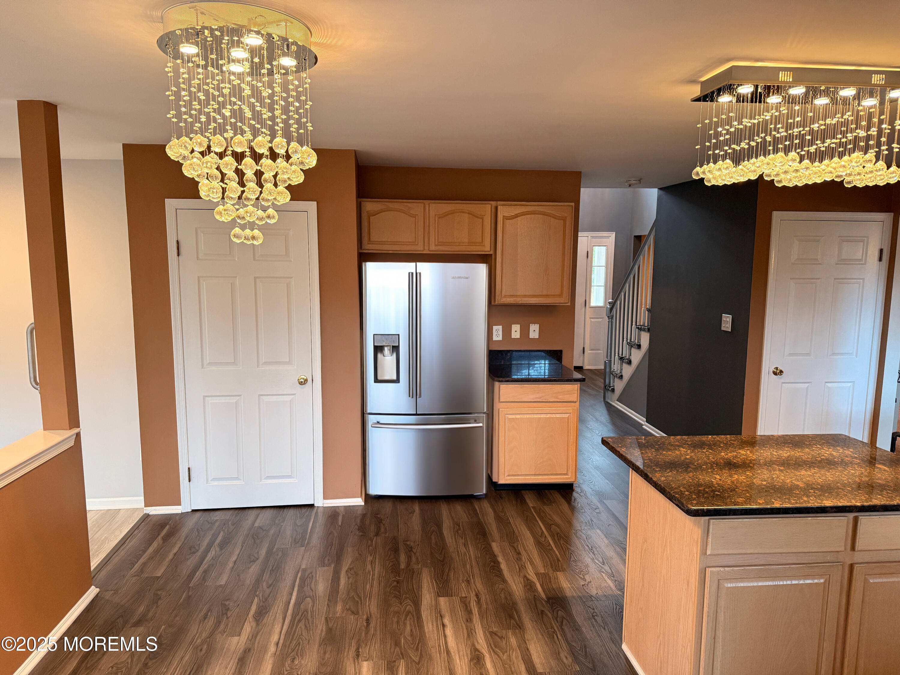 1811 Bellmore Street Oakhurst, NJ 07755 - Photo 48 of 49 a kitchen with stainless steel appliances granite countertop a refrigerator a stove and a wooden floors