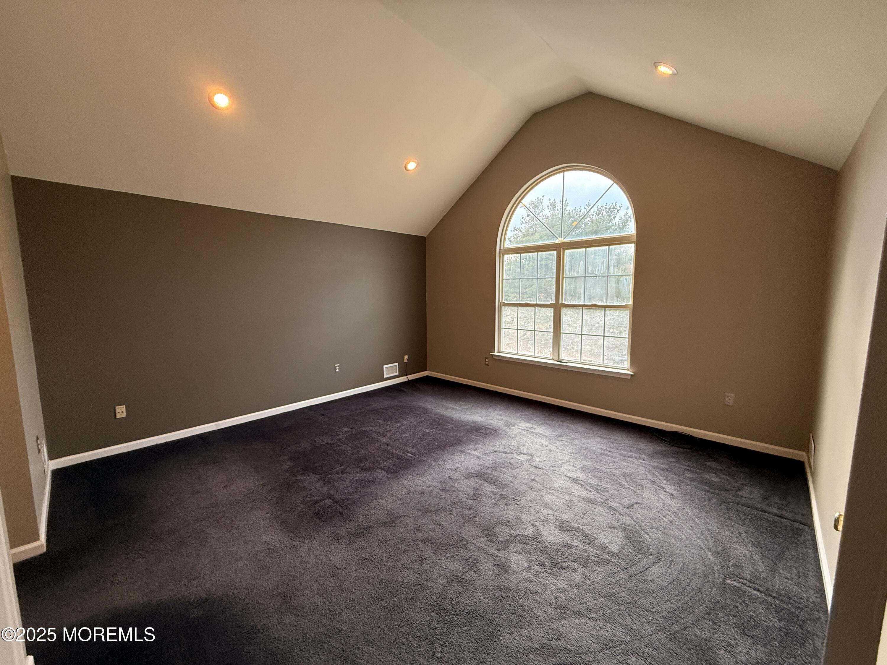 1811 Bellmore Street Oakhurst, NJ 07755 - Photo 7 of 49 an empty room with windows and fireplace