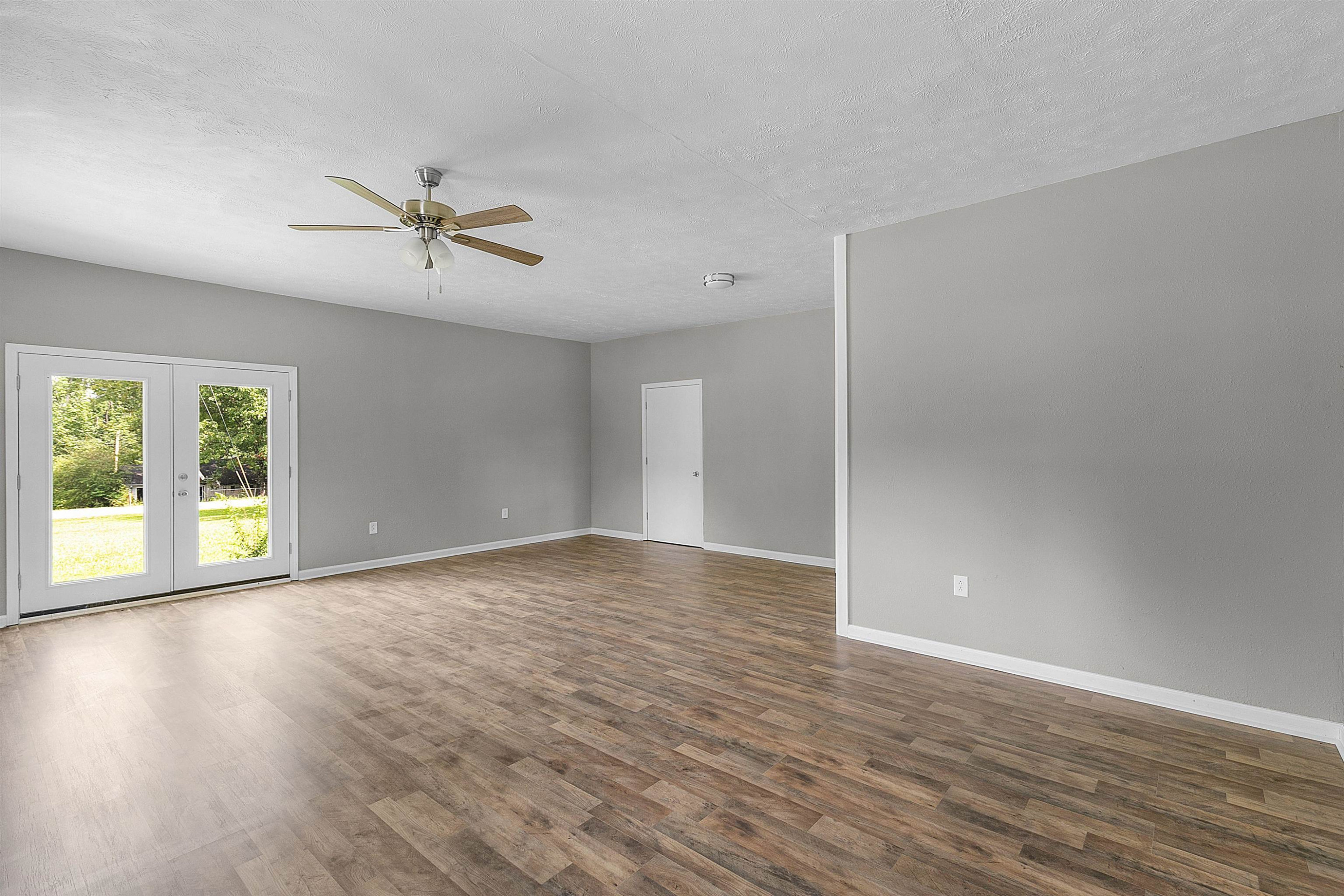 1000 Crucifer Road Huron, TN 38345 - Photo 5 of 21 a view of empty room with wooden floor and fan