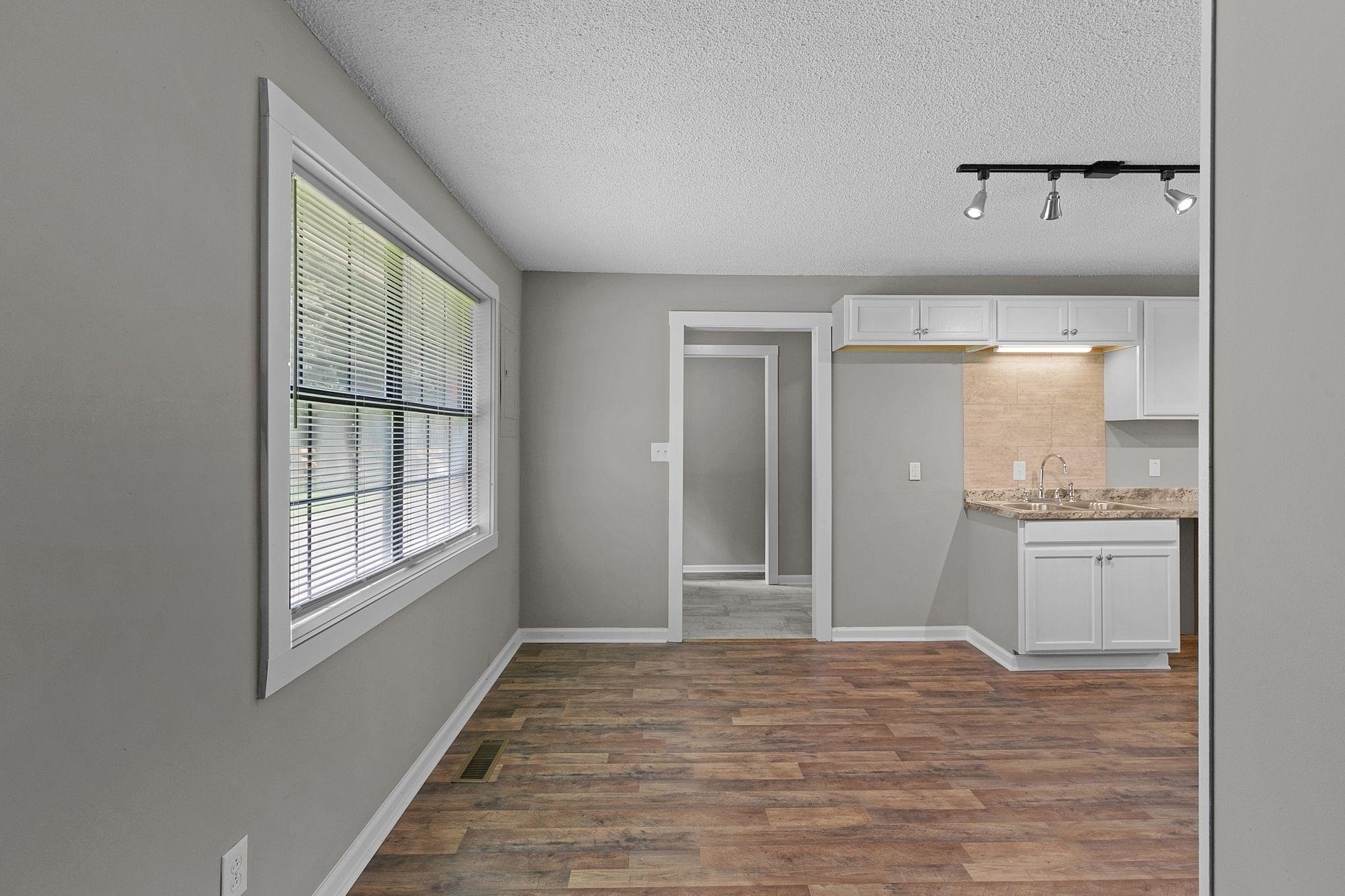 1000 Crucifer Road Huron, TN 38345 - Photo 8 of 21 a big room with wooden floor and cabinet