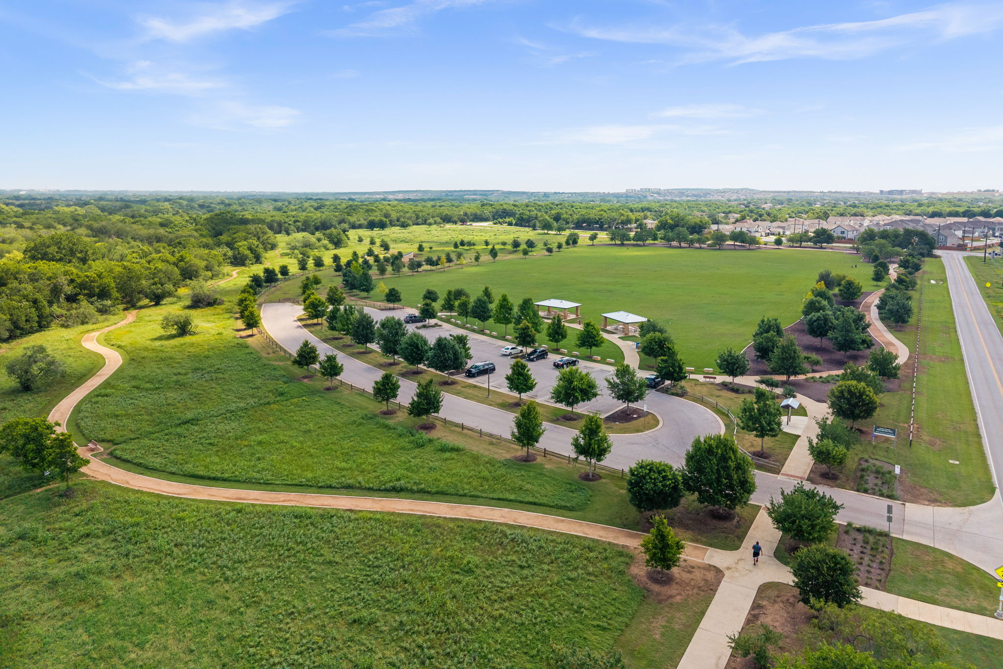 5409 Fox Wing Way Austin, TX 78747 - Photo 25 of 26 Vast green spaces with paved pathways offer residents ample room for recreation.
