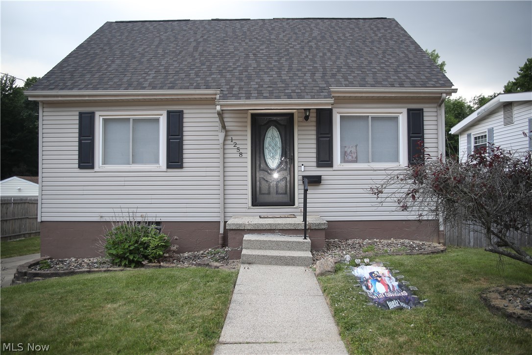 1258 Vane Avenue Akron, OH 44310 - Photo 1 of 12 Vinyl-sided exterior with a dark gray shingle roof