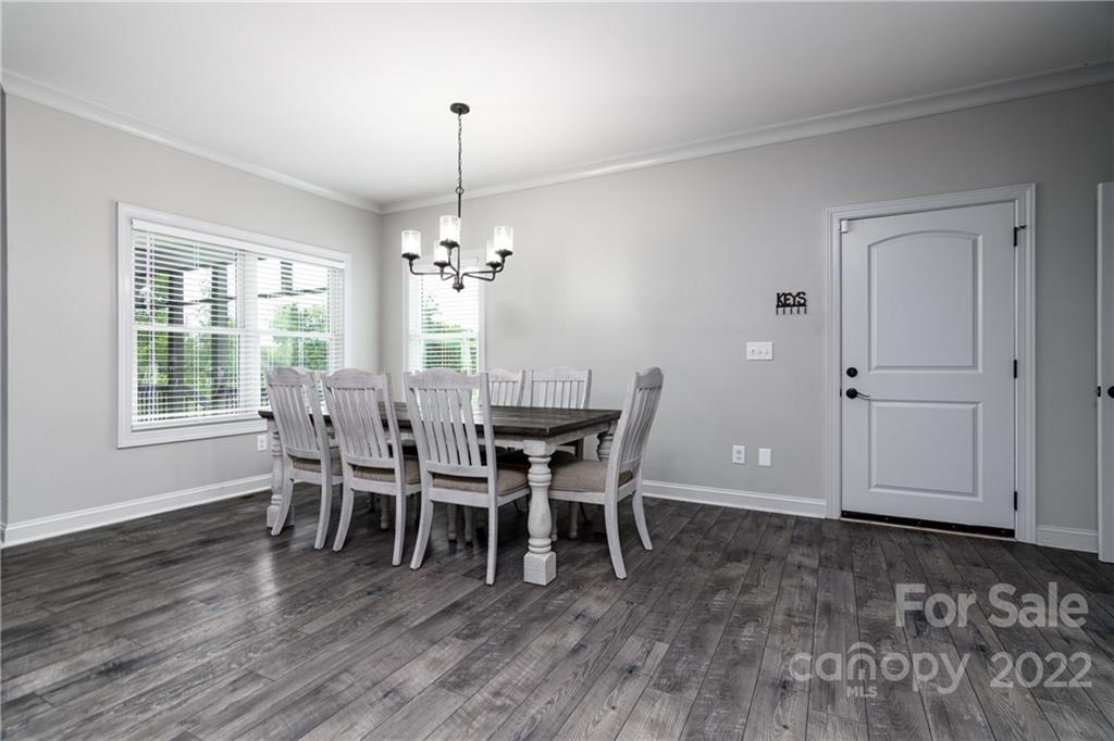 1055 Cedar Grove Road Clover, SC 29710 - Photo 14 of 46 a view of a dining room with furniture window and wooden floor