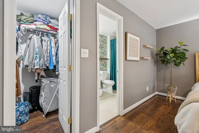 a view of a room with gym equipment and a large window