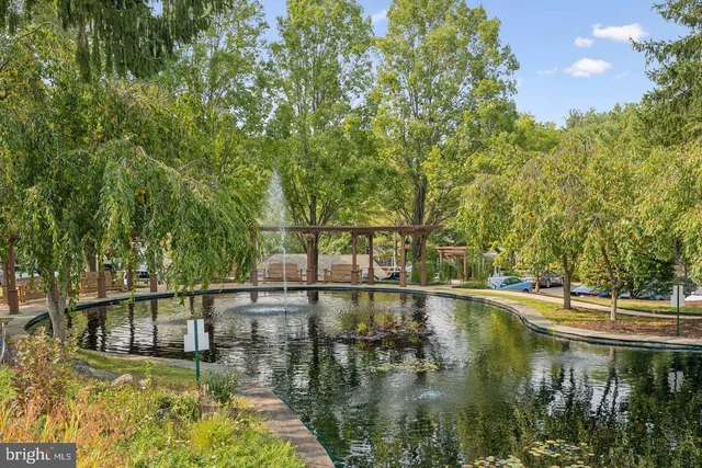 a front view of a house with a lake view